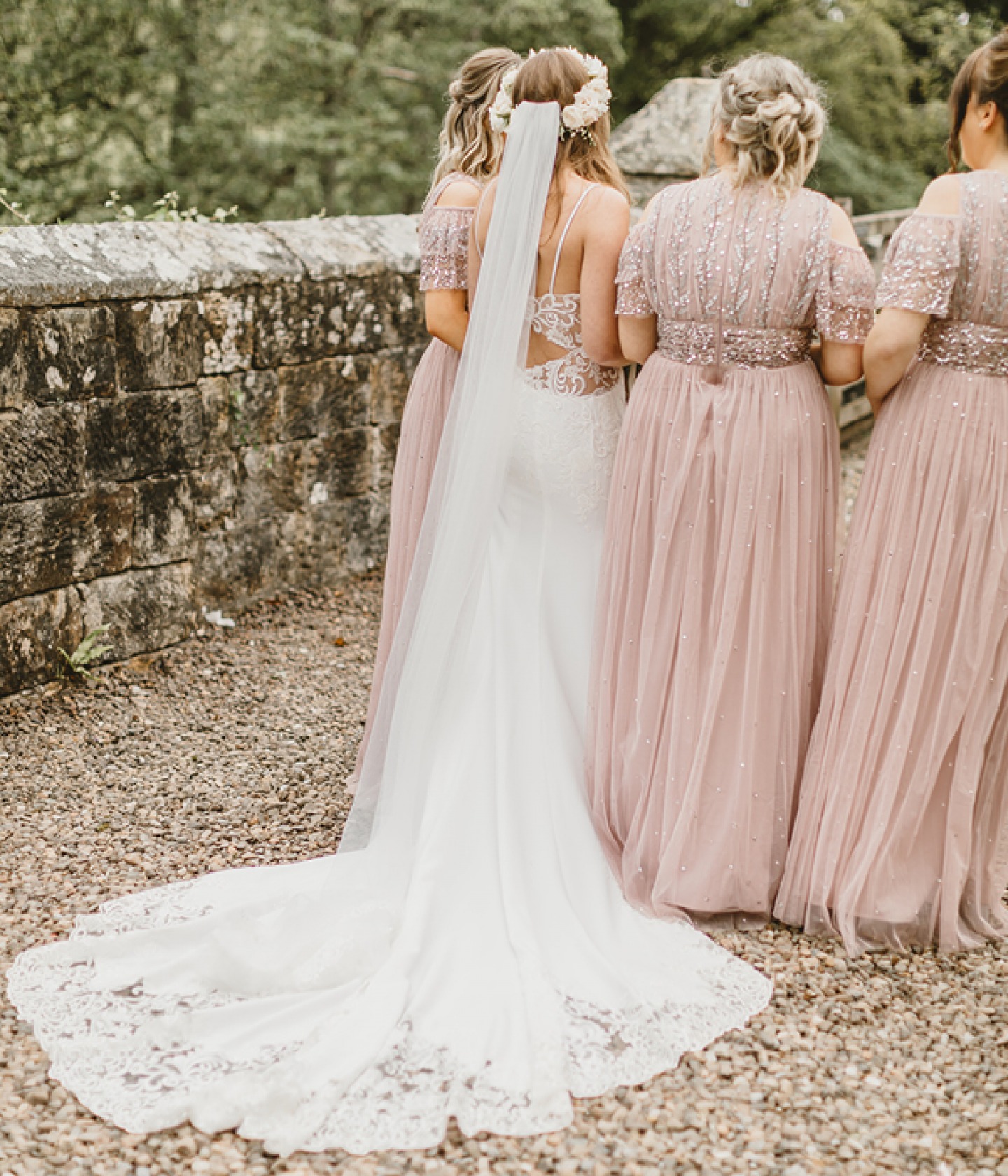 backs of the bridesmaid and bride