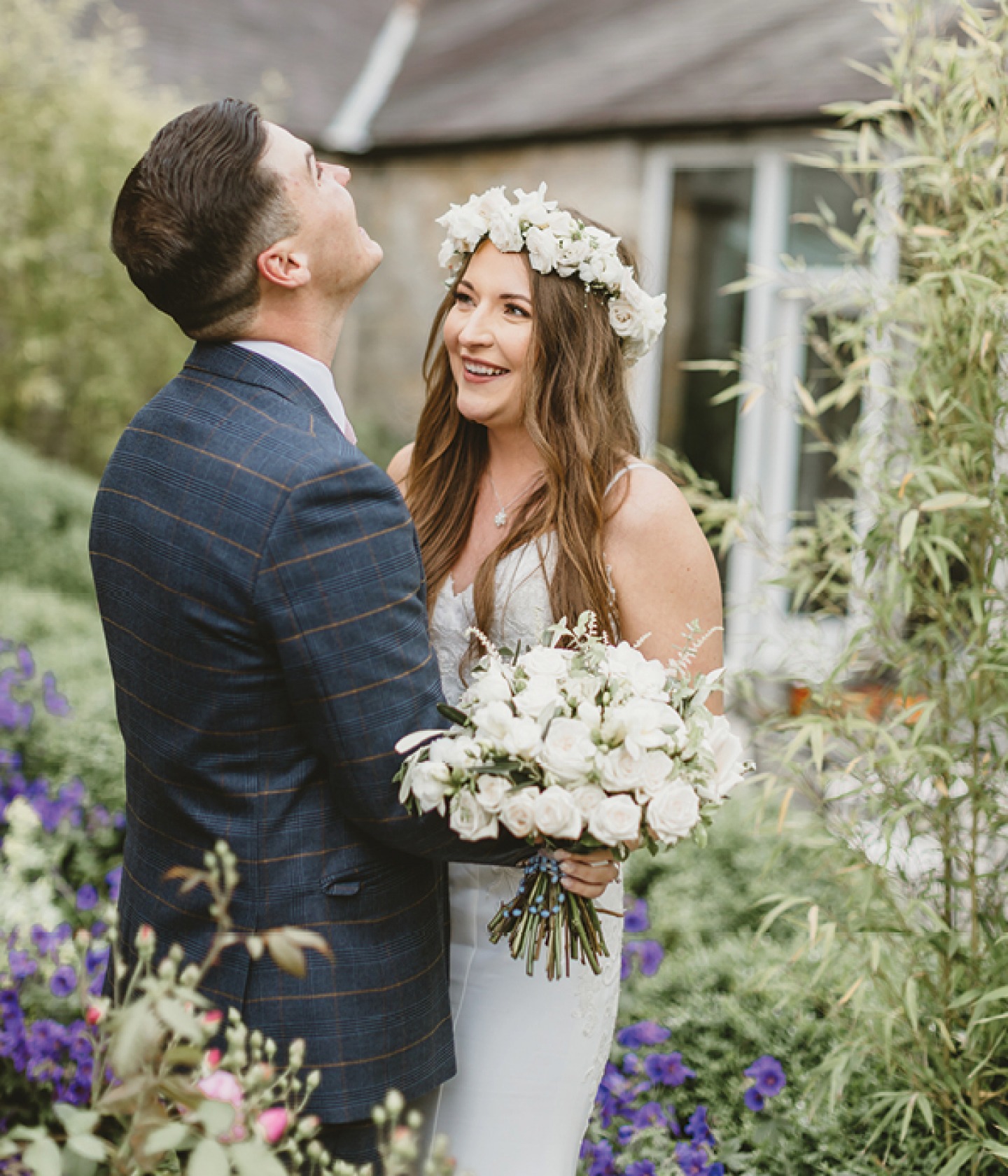 bride and groom laughing in the gardens