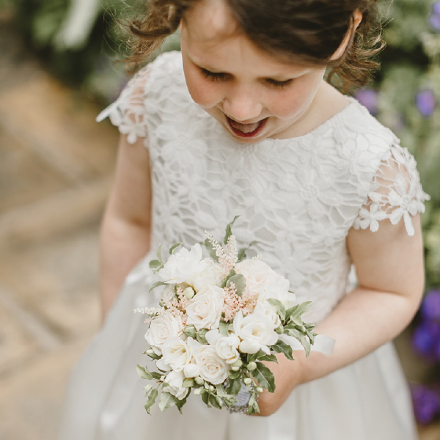 flower girl looking other flowers
