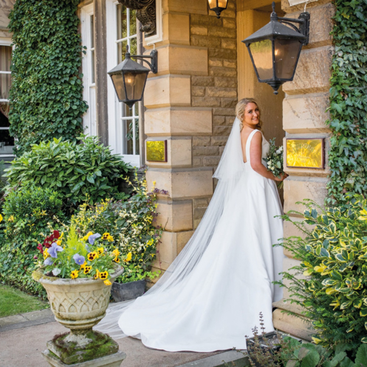bride posing in doorway