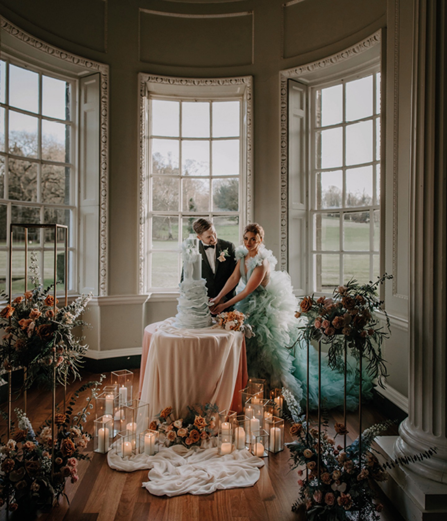 bride and groom cutting the cake