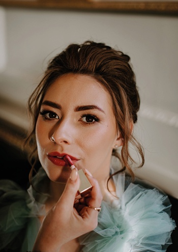 bride getting lipstick applied