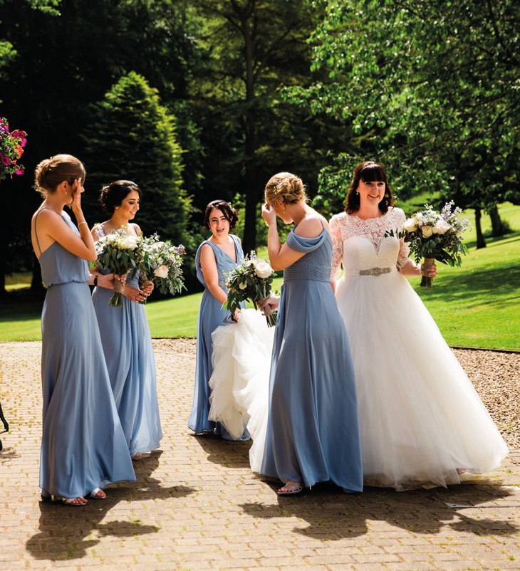 bridesmaids and bride outside