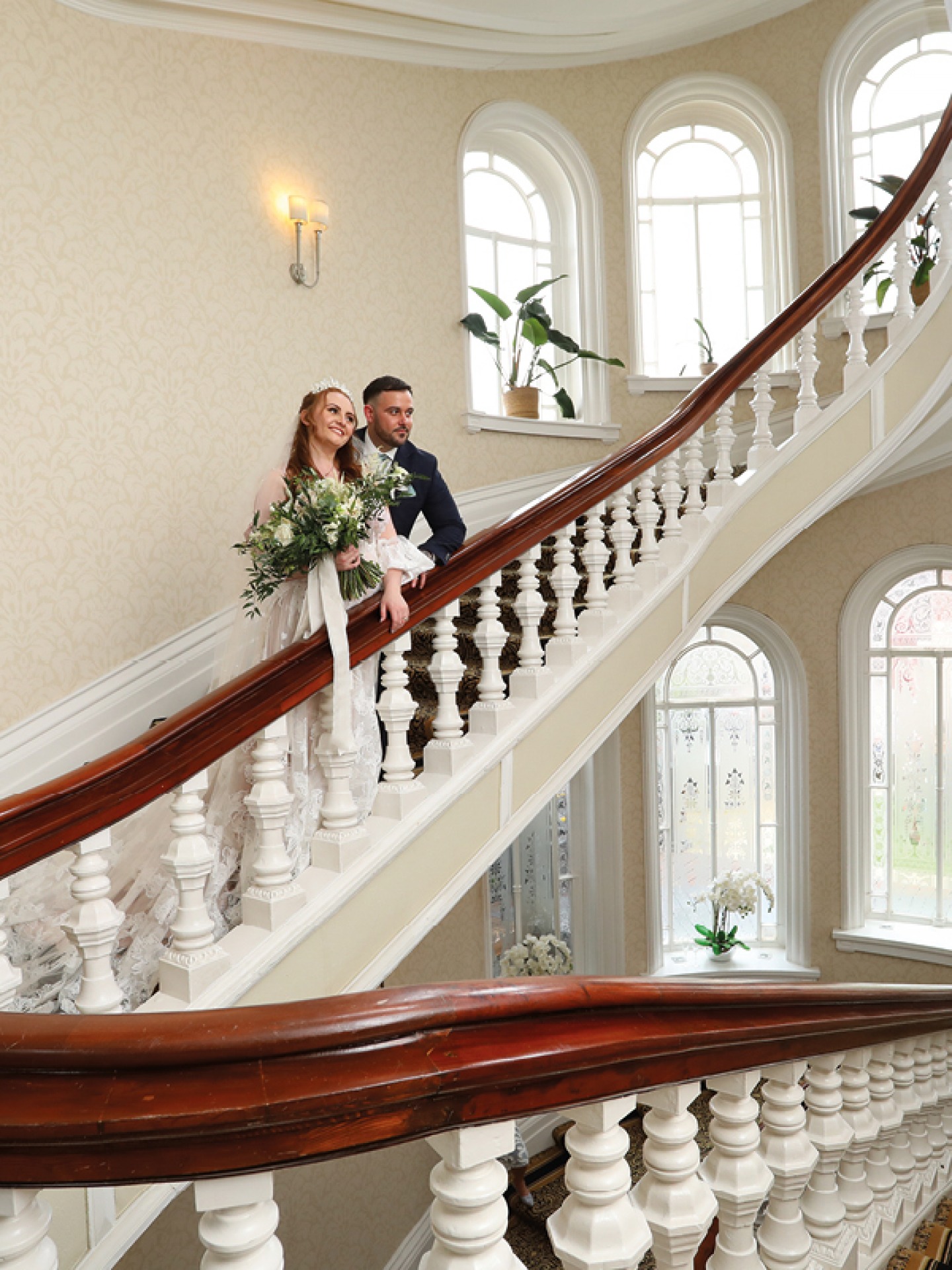 Bride and groom on staircase