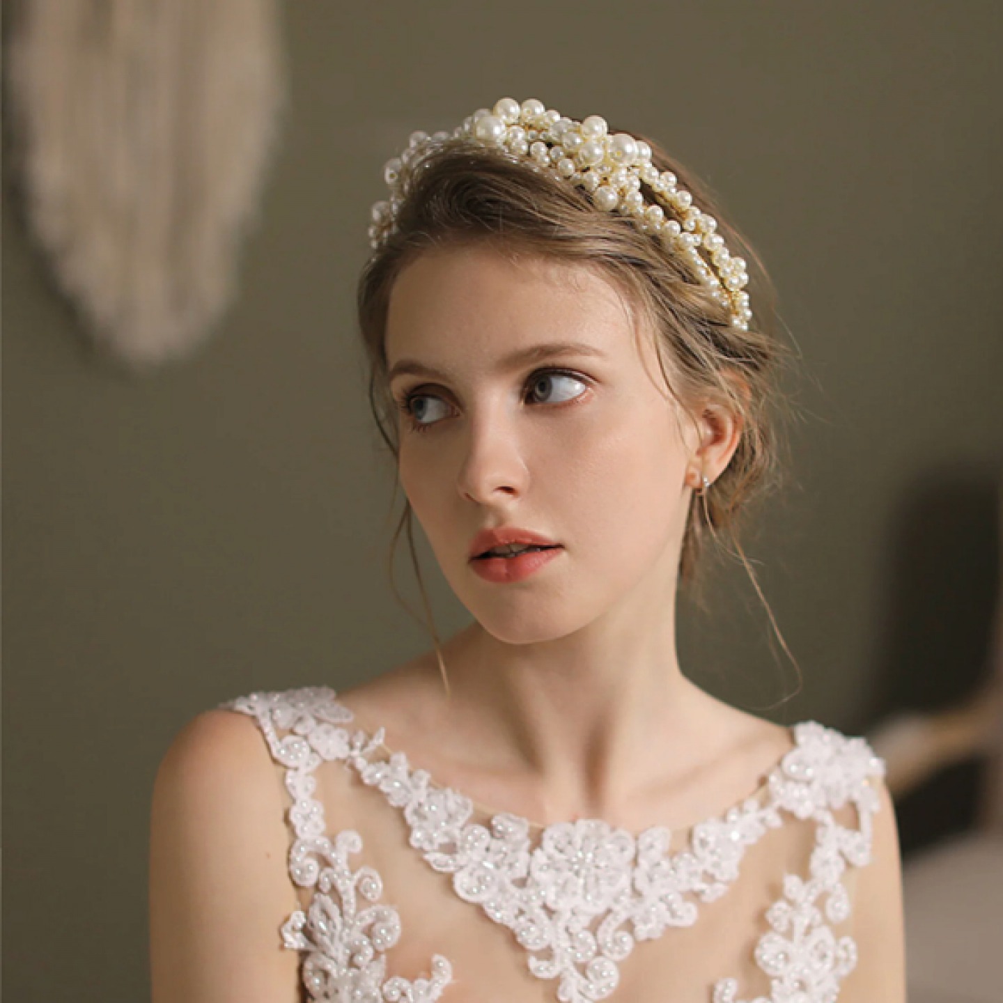 Bride wearing Statement head piece and earrings