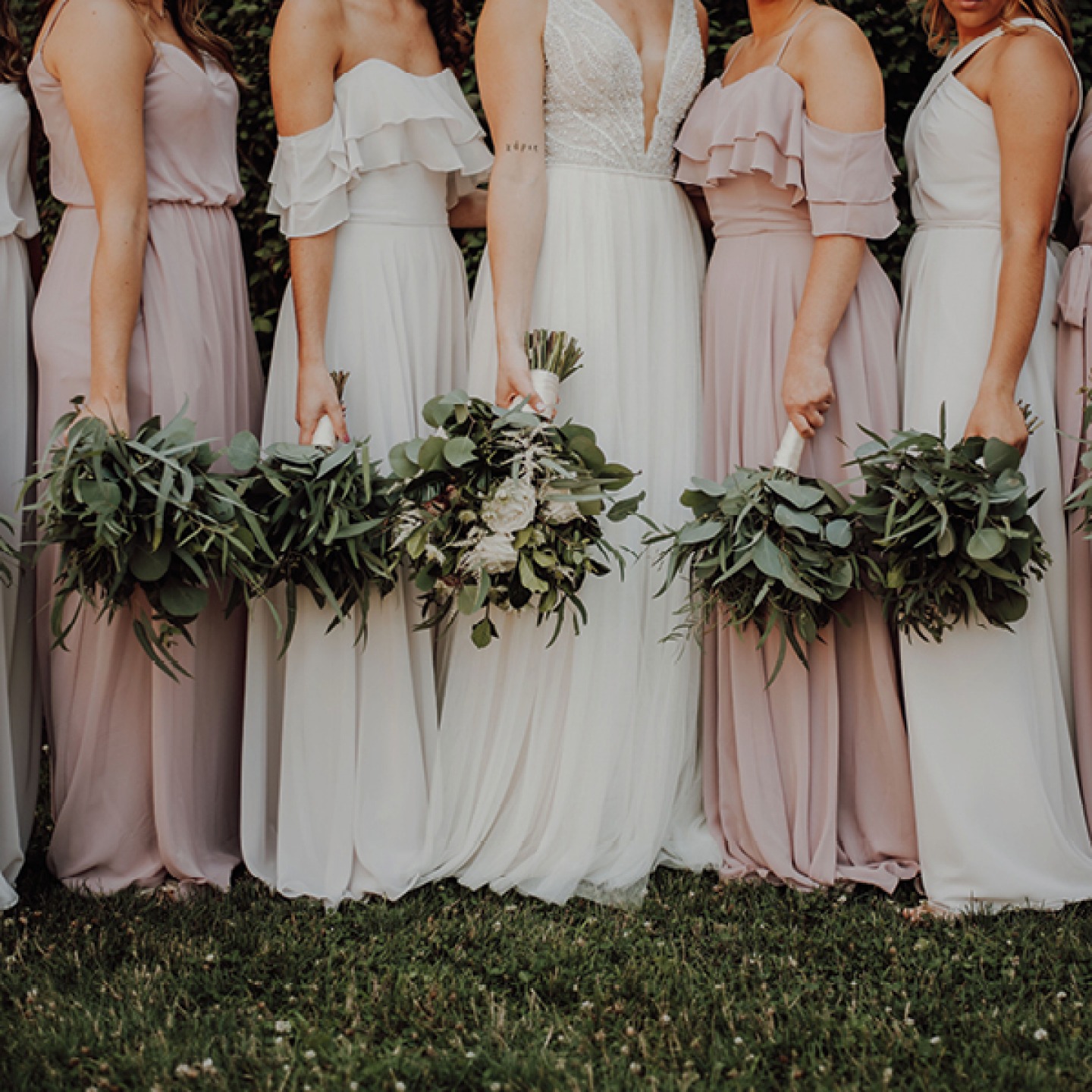 Bride and Bridesmaids holding their bouquets down