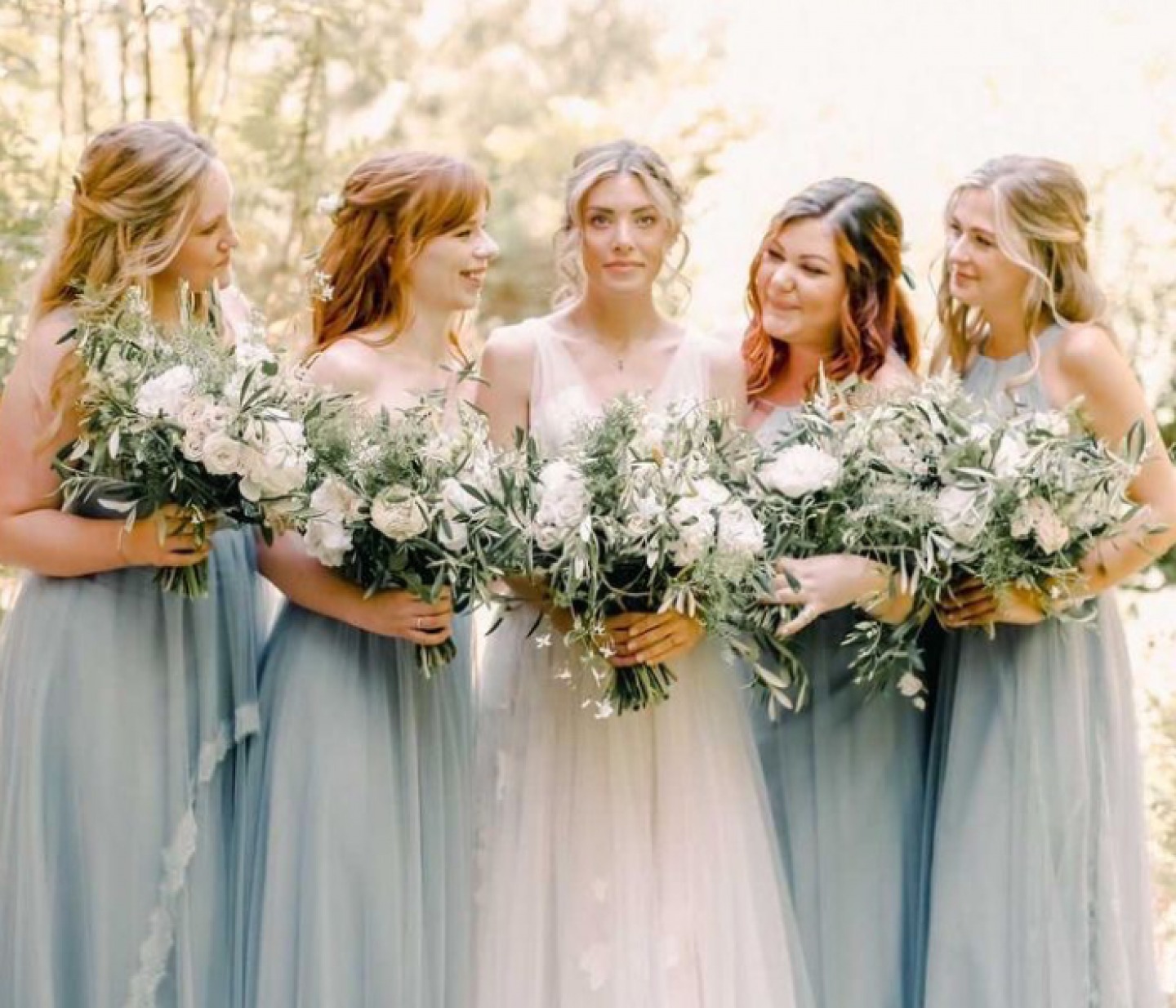 Bride and Bridesmaids posing with bouquets