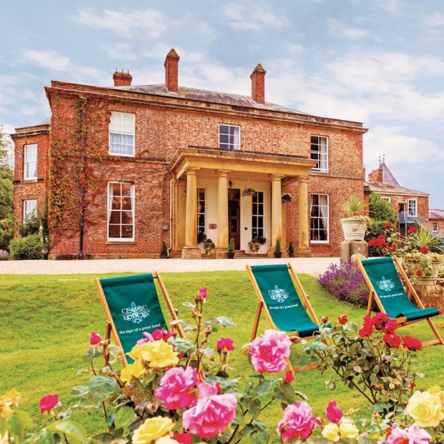 external shot of Solberge Hall with deck chairs set out