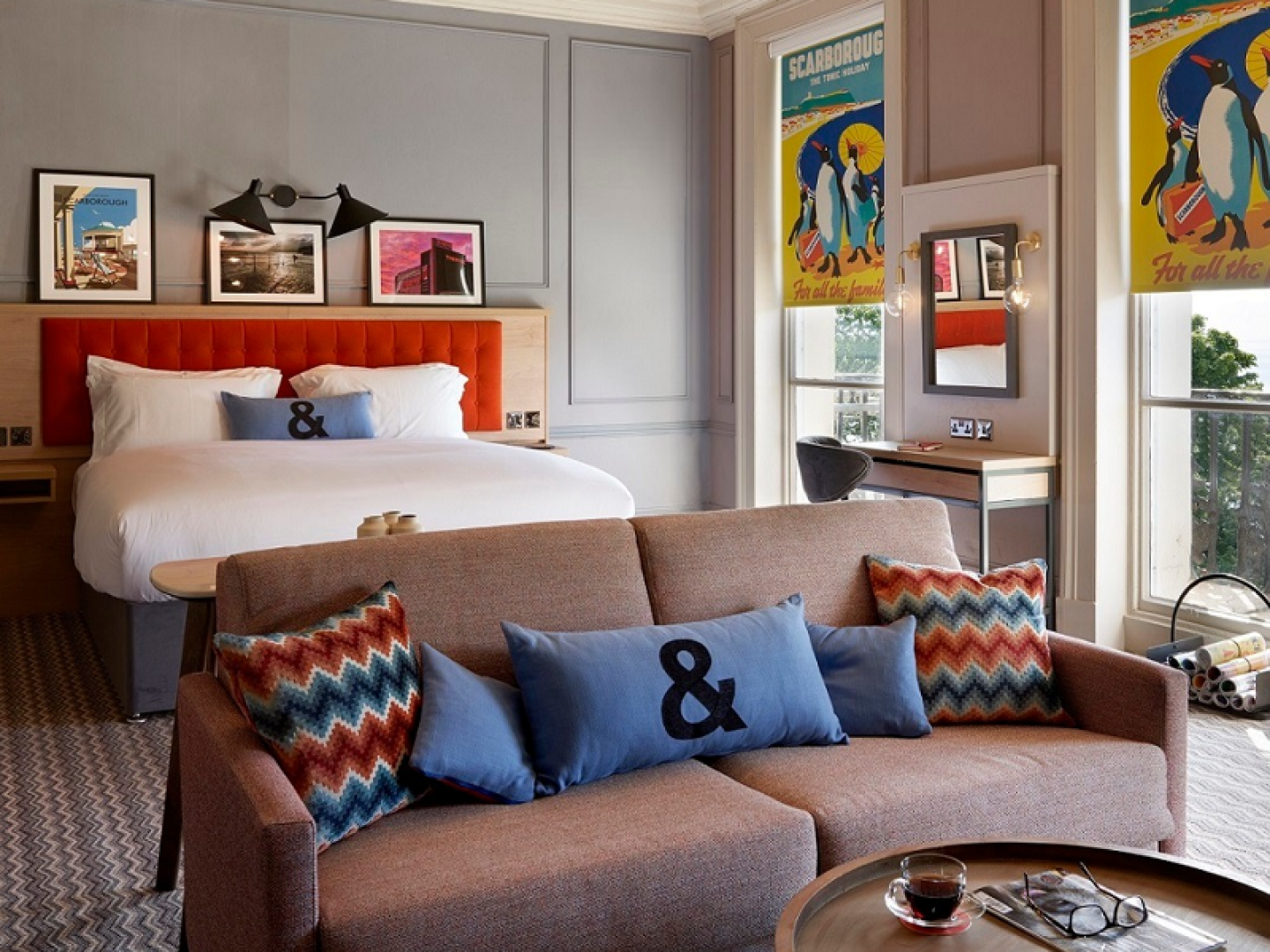 hotel room with a double bed and sofa
