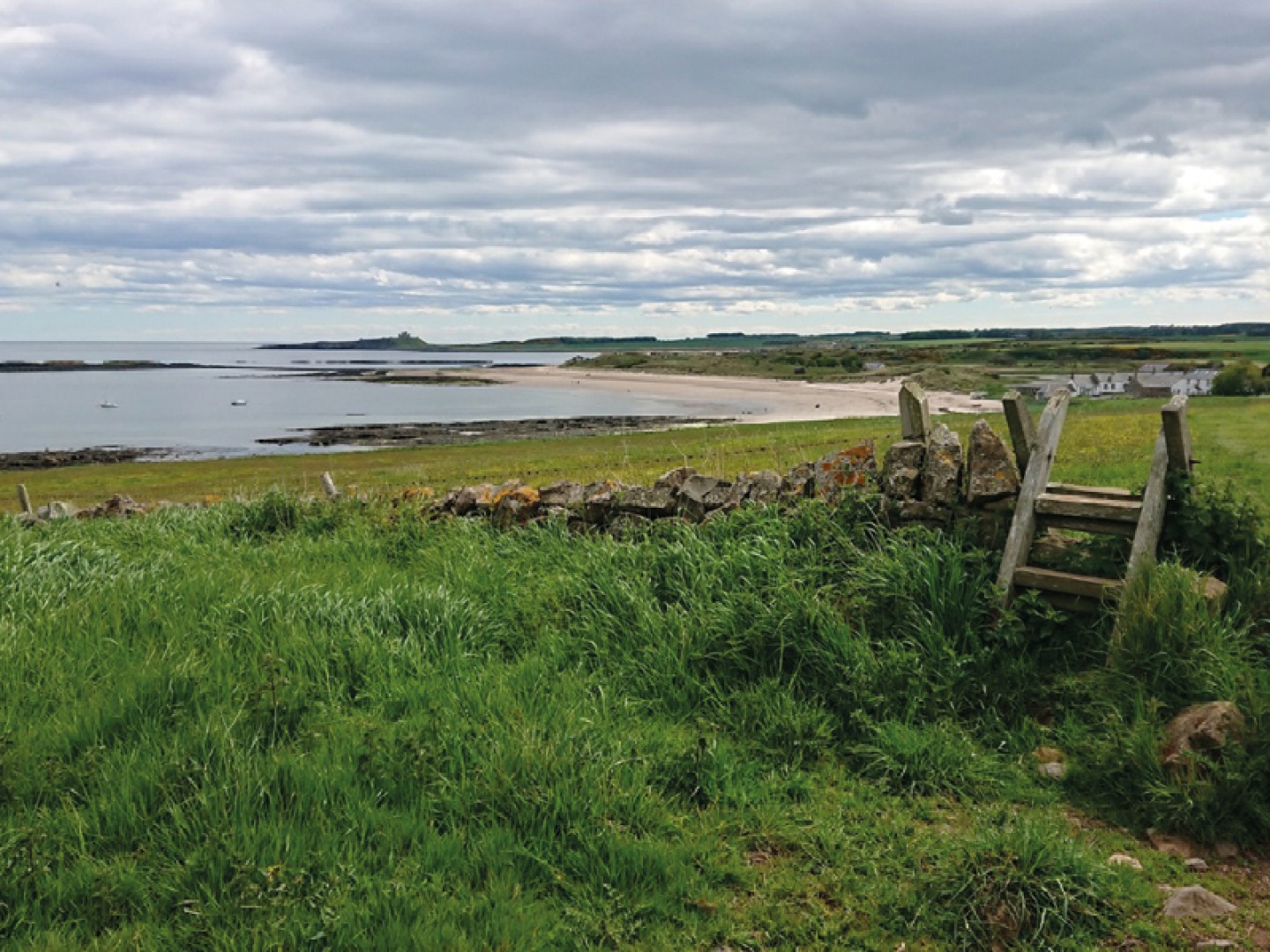 Dunstanburgh with views across the beach