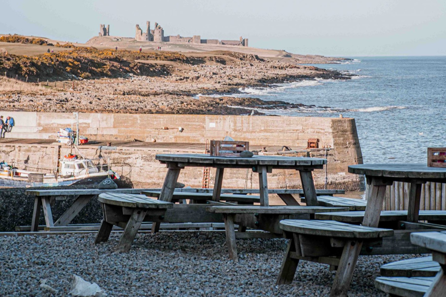 The Jolly Fisherman’s beer garden looking over to Dunstanburgh Castle
