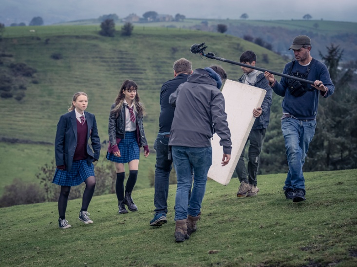 film crew filming two school girls