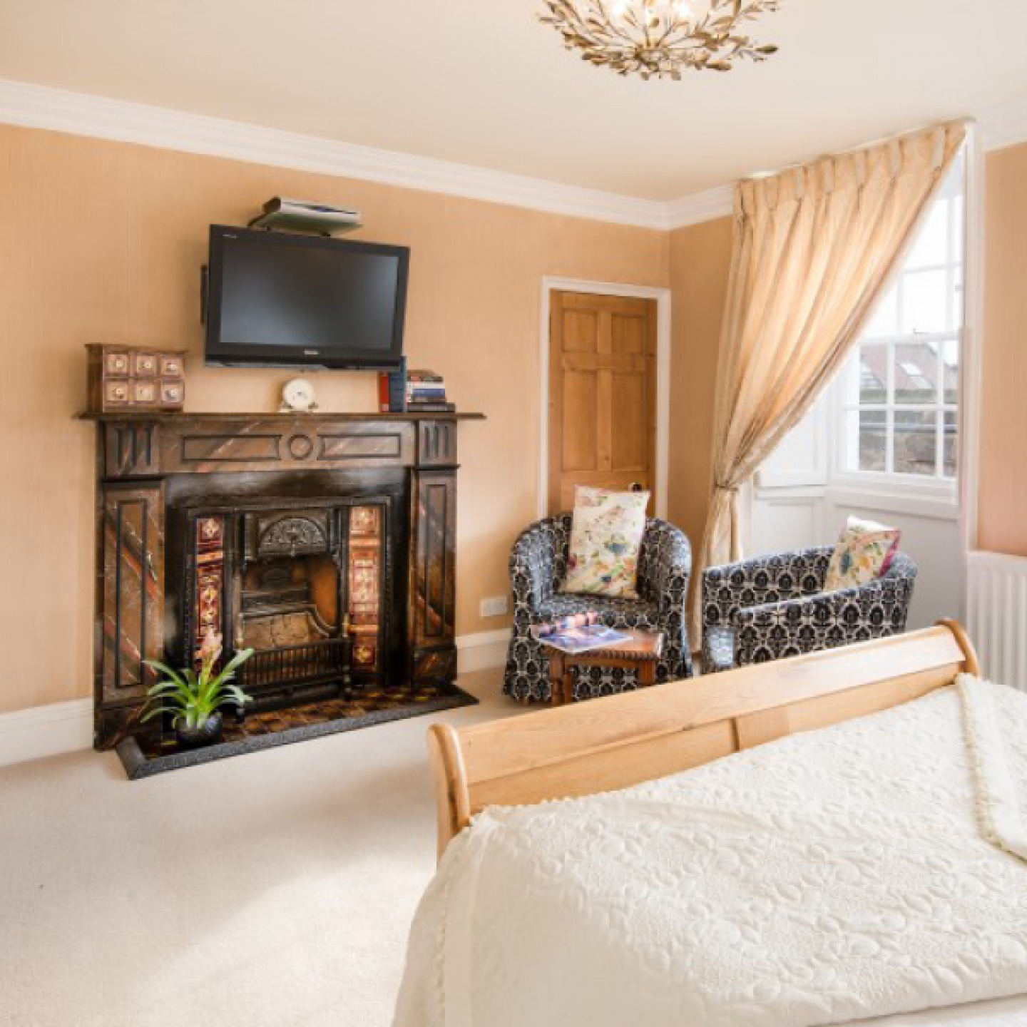 bedroom with period fireplace