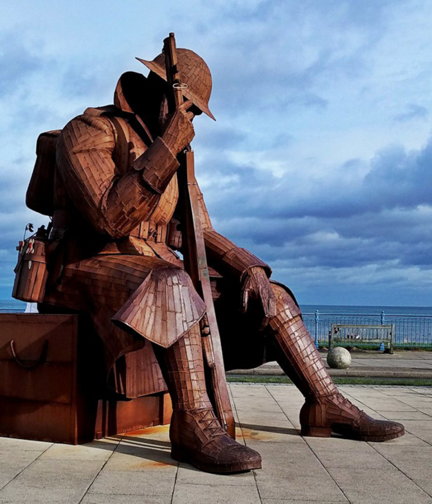 Large sculpture of a soldier sitting