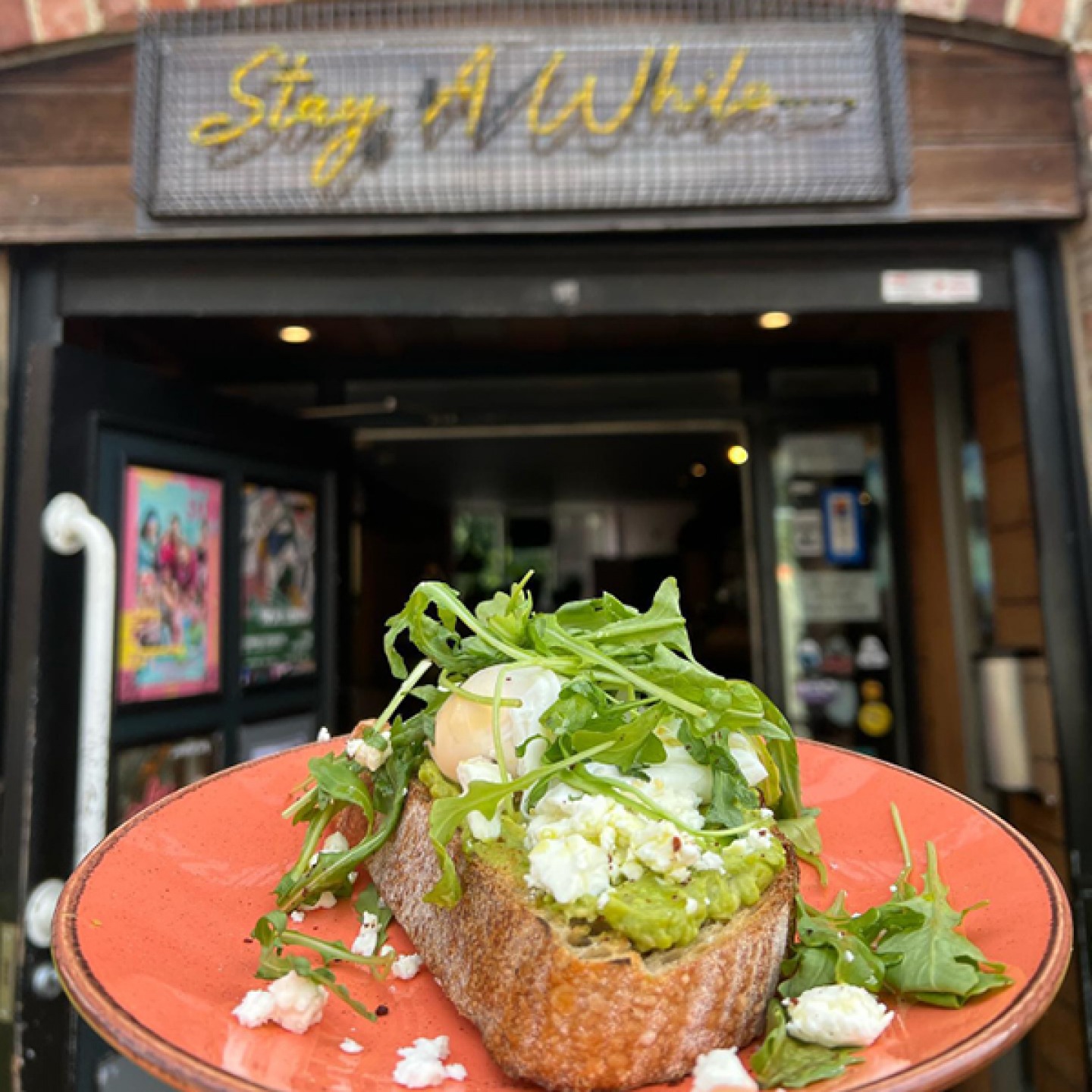 plate of avocado on toast at the door of Ernest