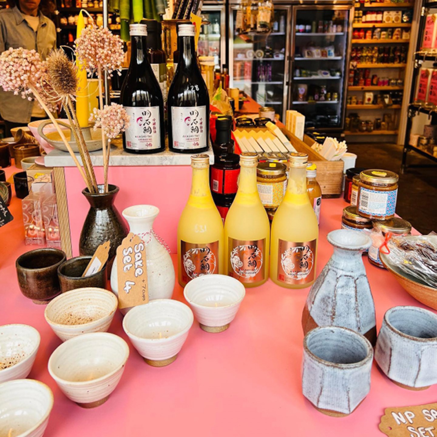 Pots, bowls, bottles and foodie products in shop setting at Ernie