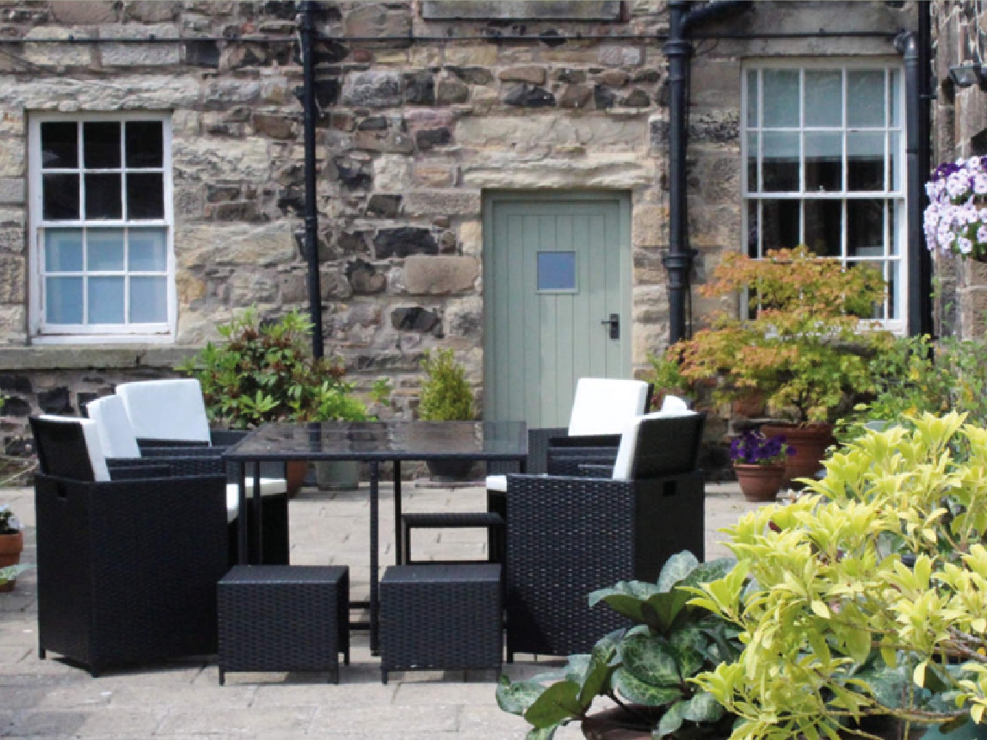 Patio area with plants and furniture