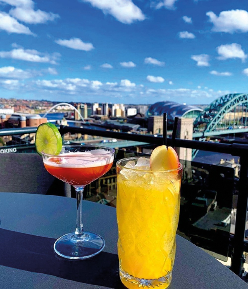 cocktails on a table over looking Newcastle/Gateshead quayside