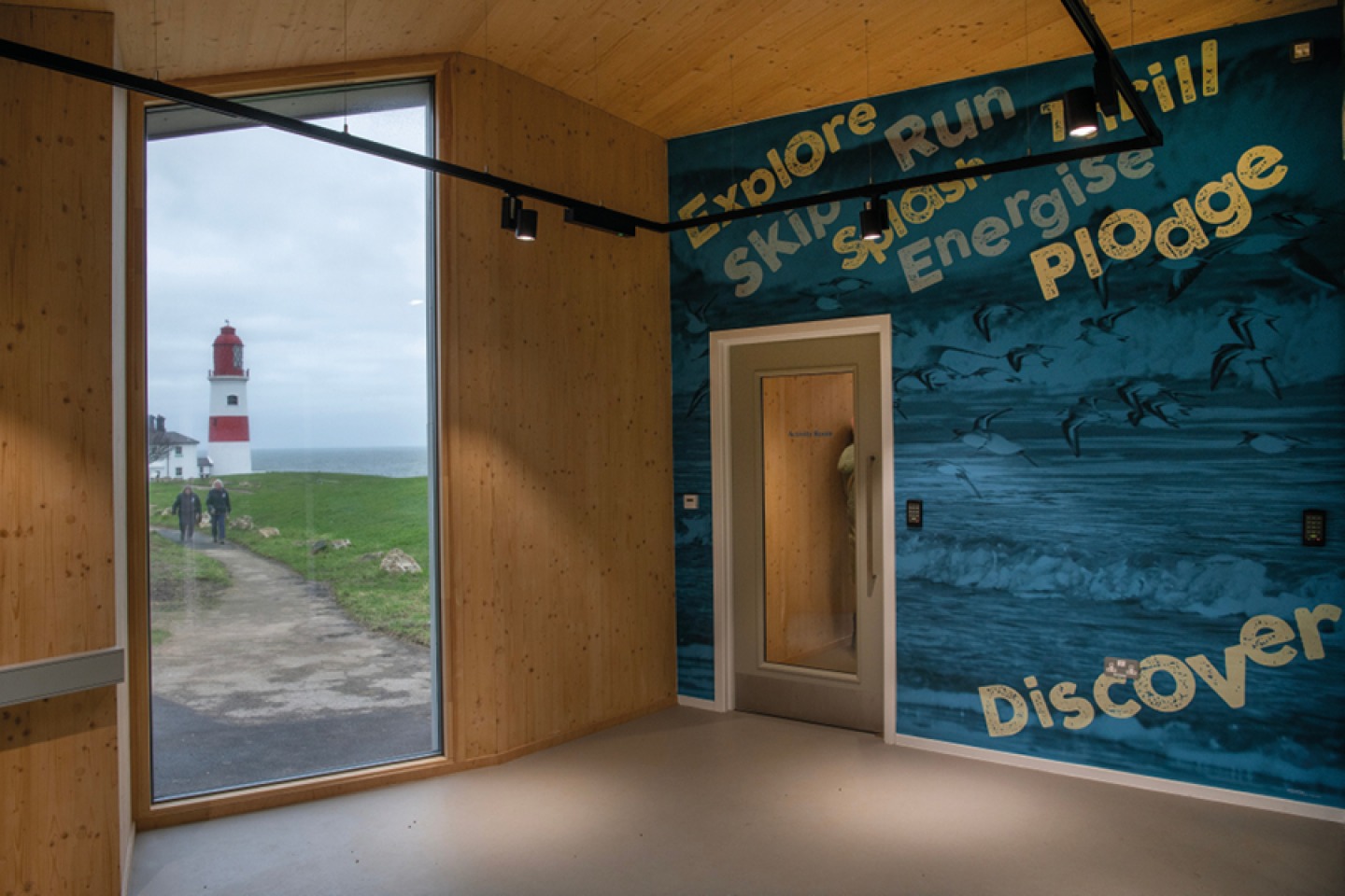 Inside Whitburn Coastal Conservation Centre looking out to Souter Lighthouse