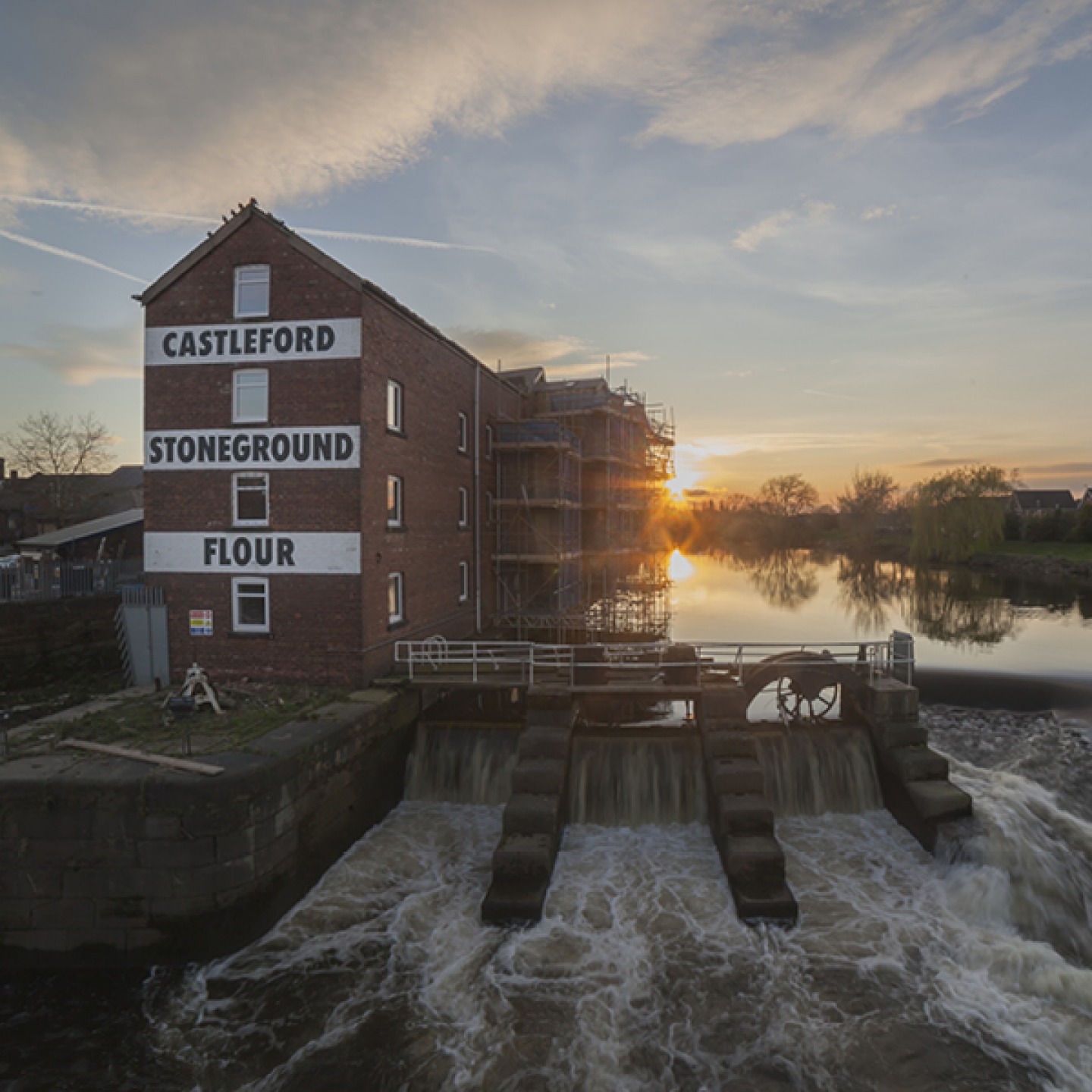 Castleford footbridge and stoneground flour mill at sunset