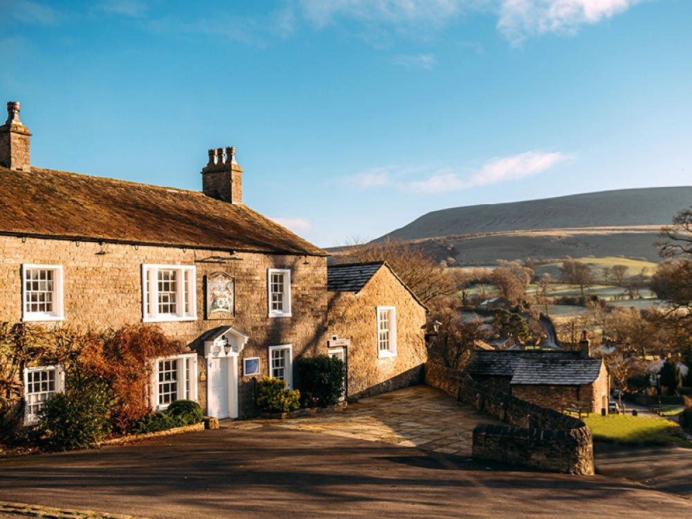 country pub with hills in the background
