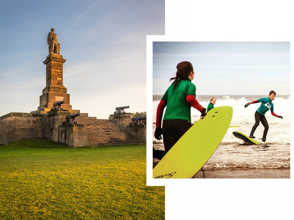 Collingwood Monument and people with surf board at the shore