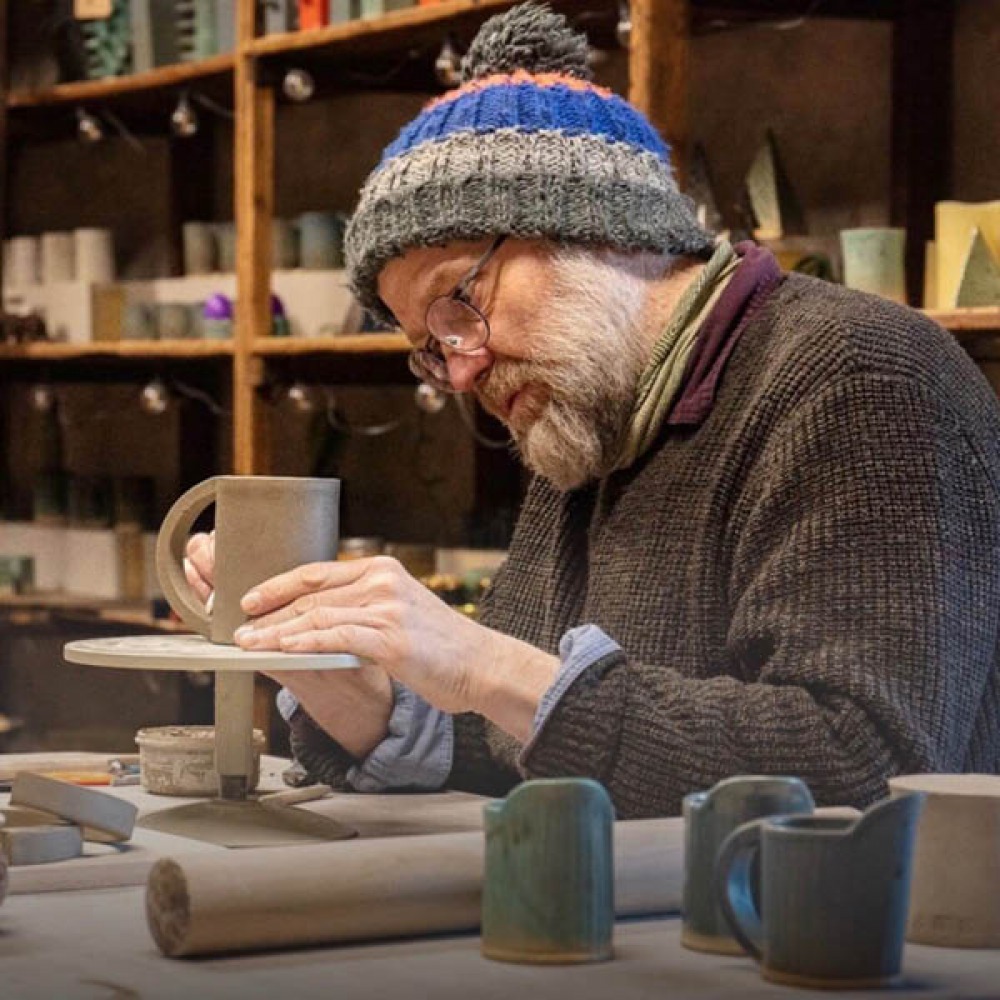 man doing pottery