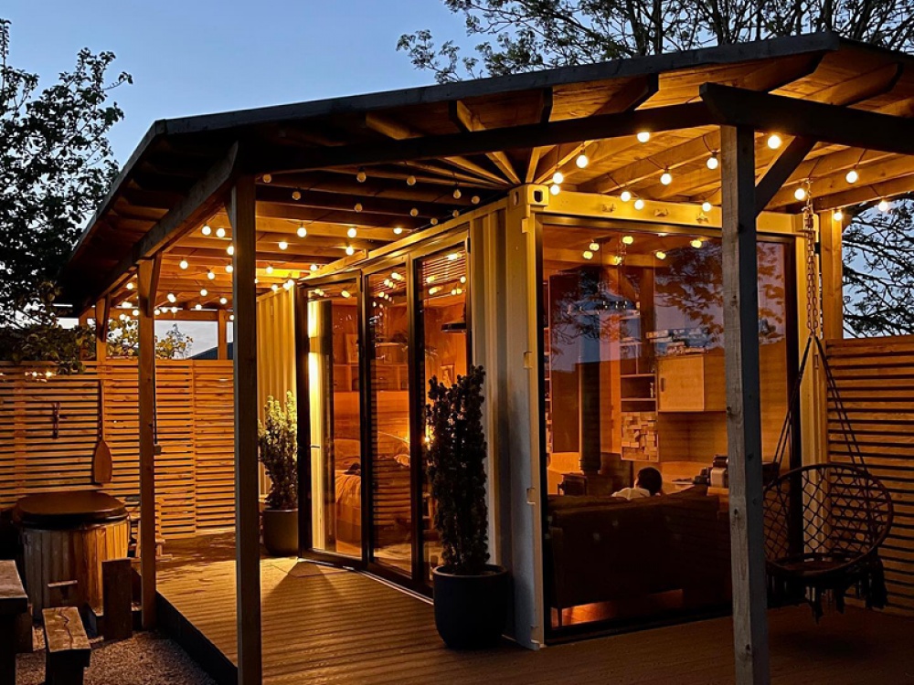 cabin in the garden lit with fairy lights