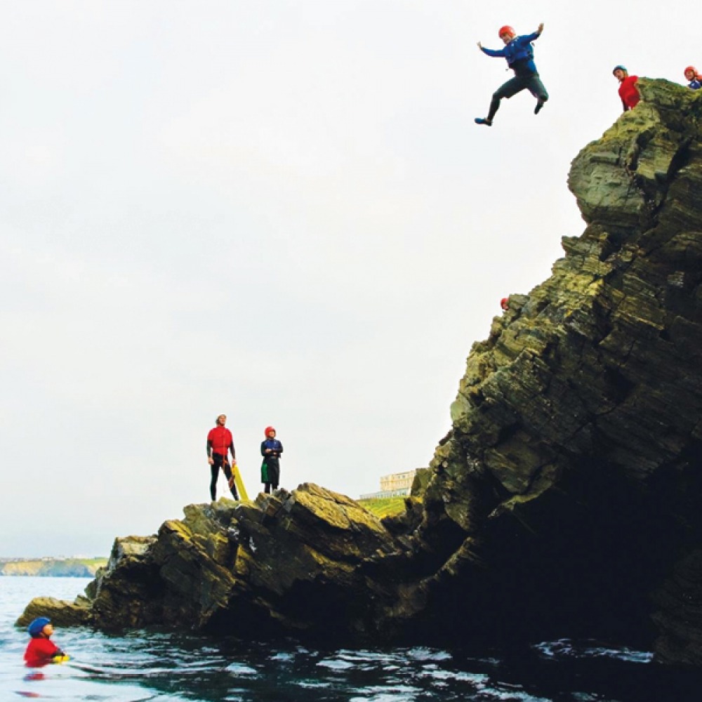 cliff jumping into the sea