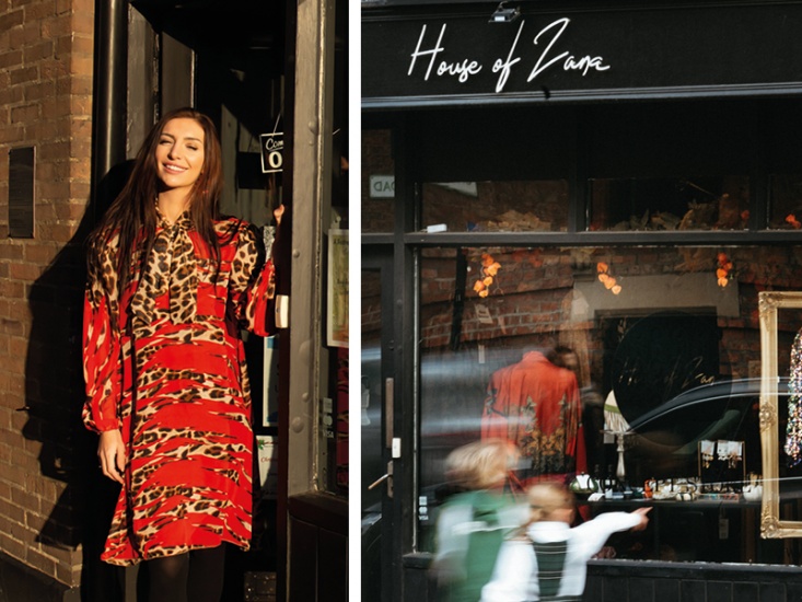 English country street with shopping signs and fairy lights