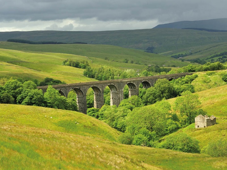 countryside rolling hills and train viaduct