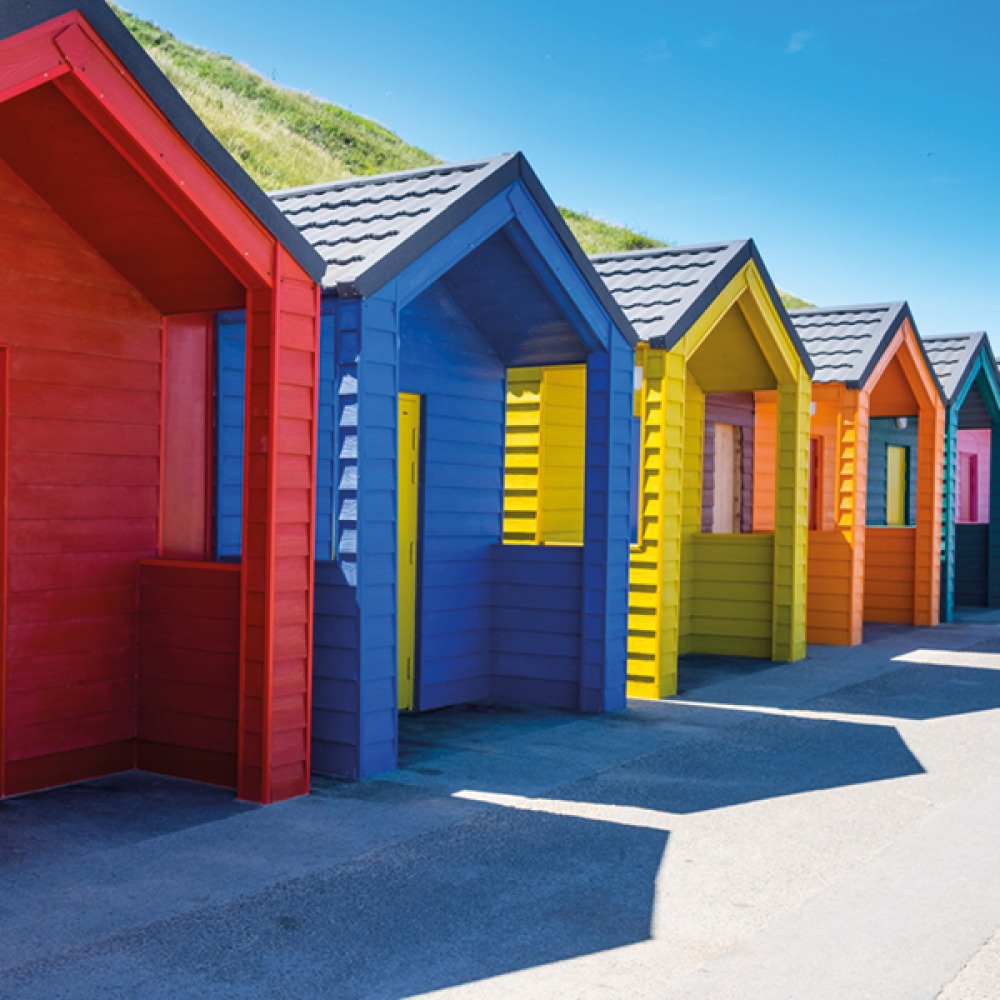 multicoloured beach huts