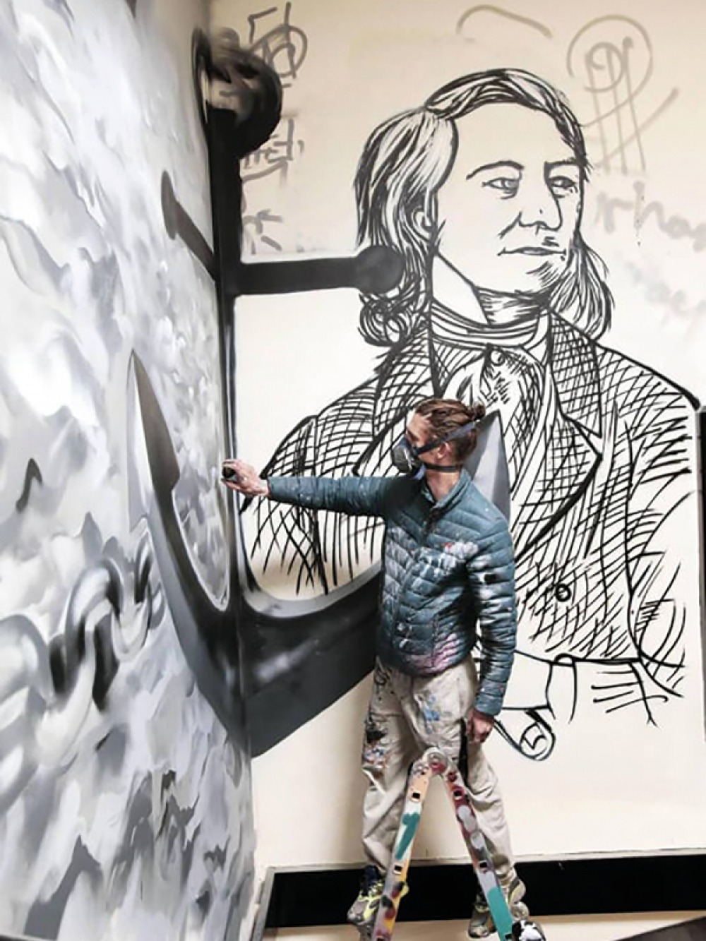 Lewis Dobson spray painting walls
