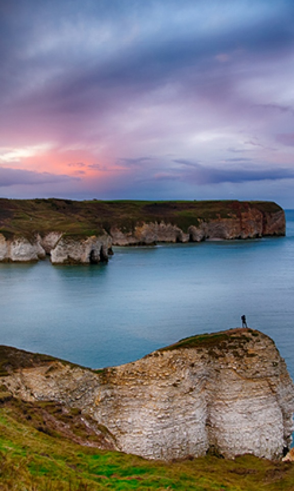 cliff and sea at sunset