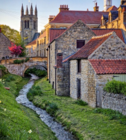 buildings with a stream
