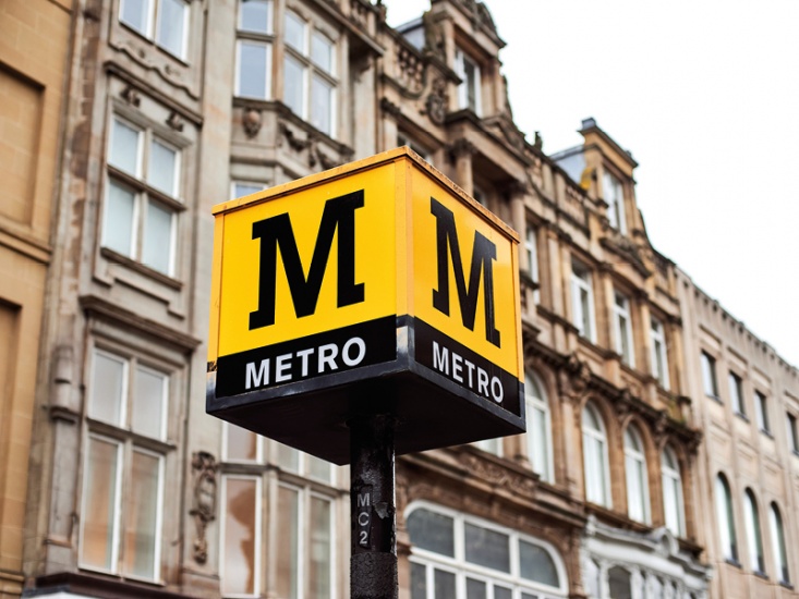 yellow and black 'Metro' sign