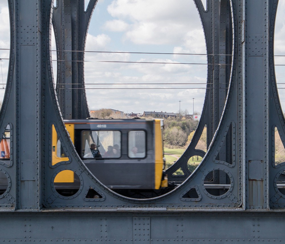 Metro traveling across bridge