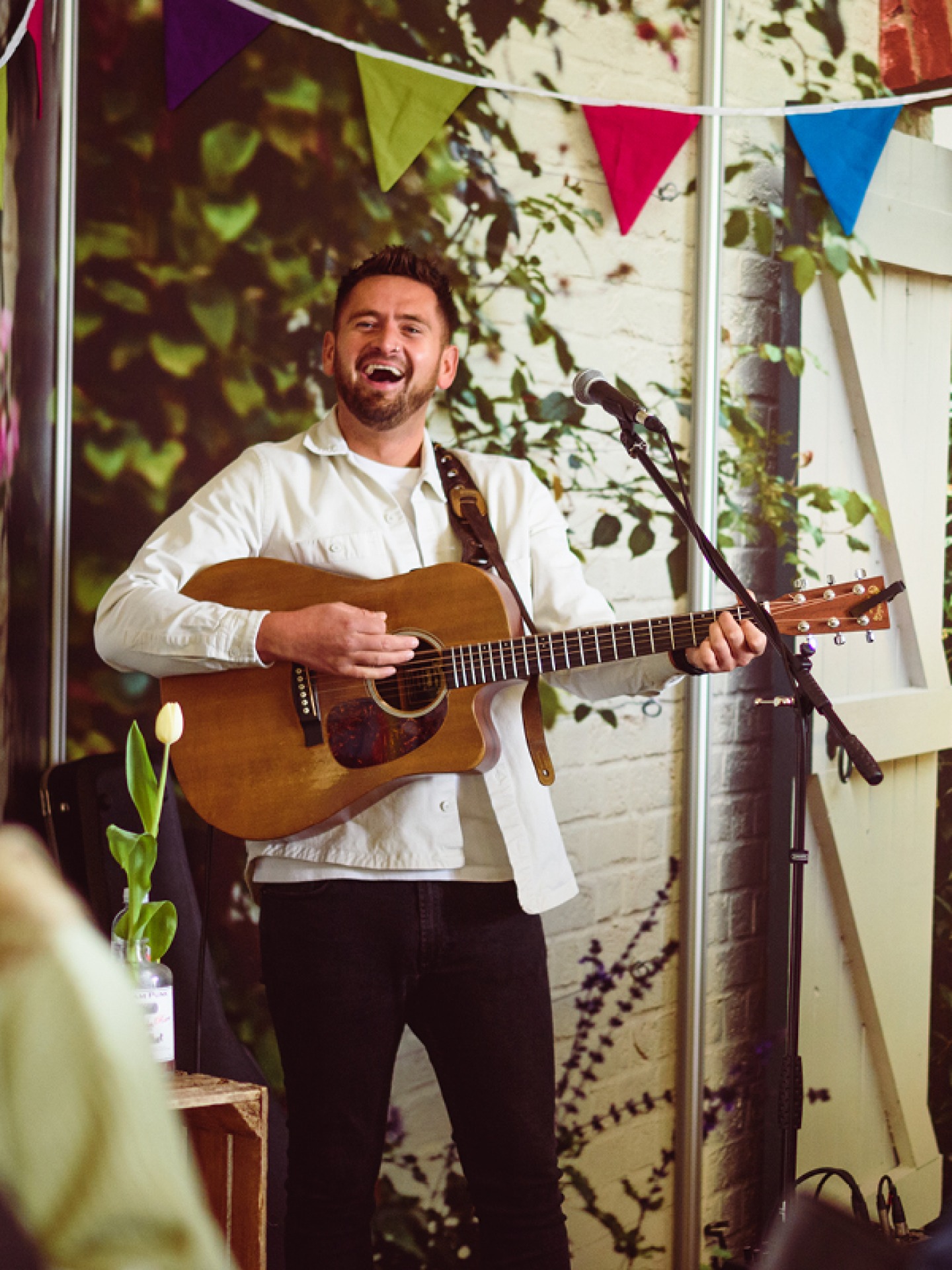 man singing with a guitar