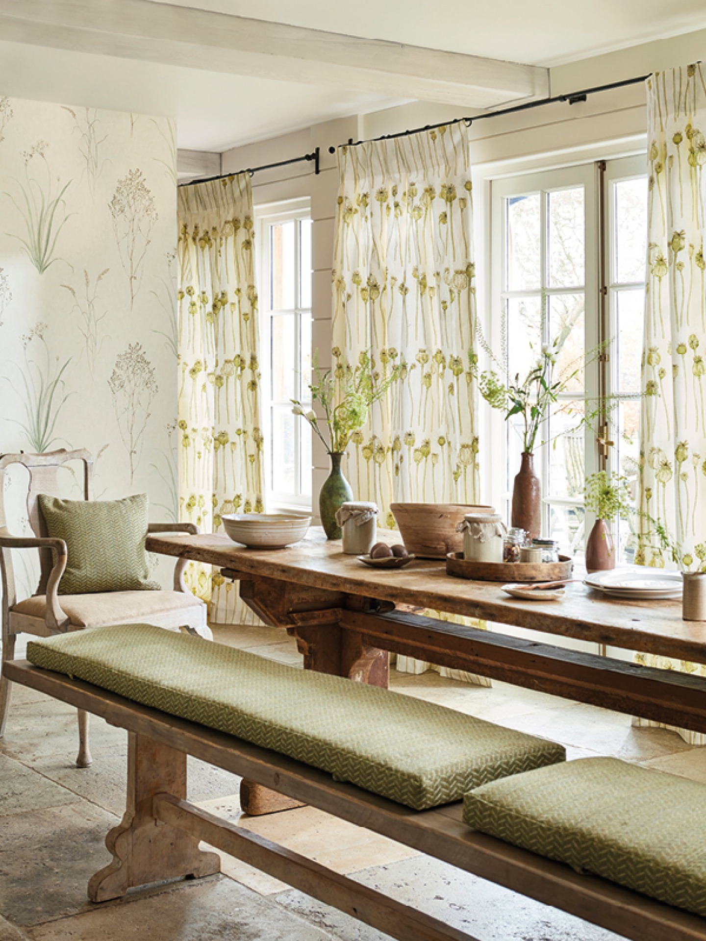 interior shot of a kitchen table with wooden and green accessories
