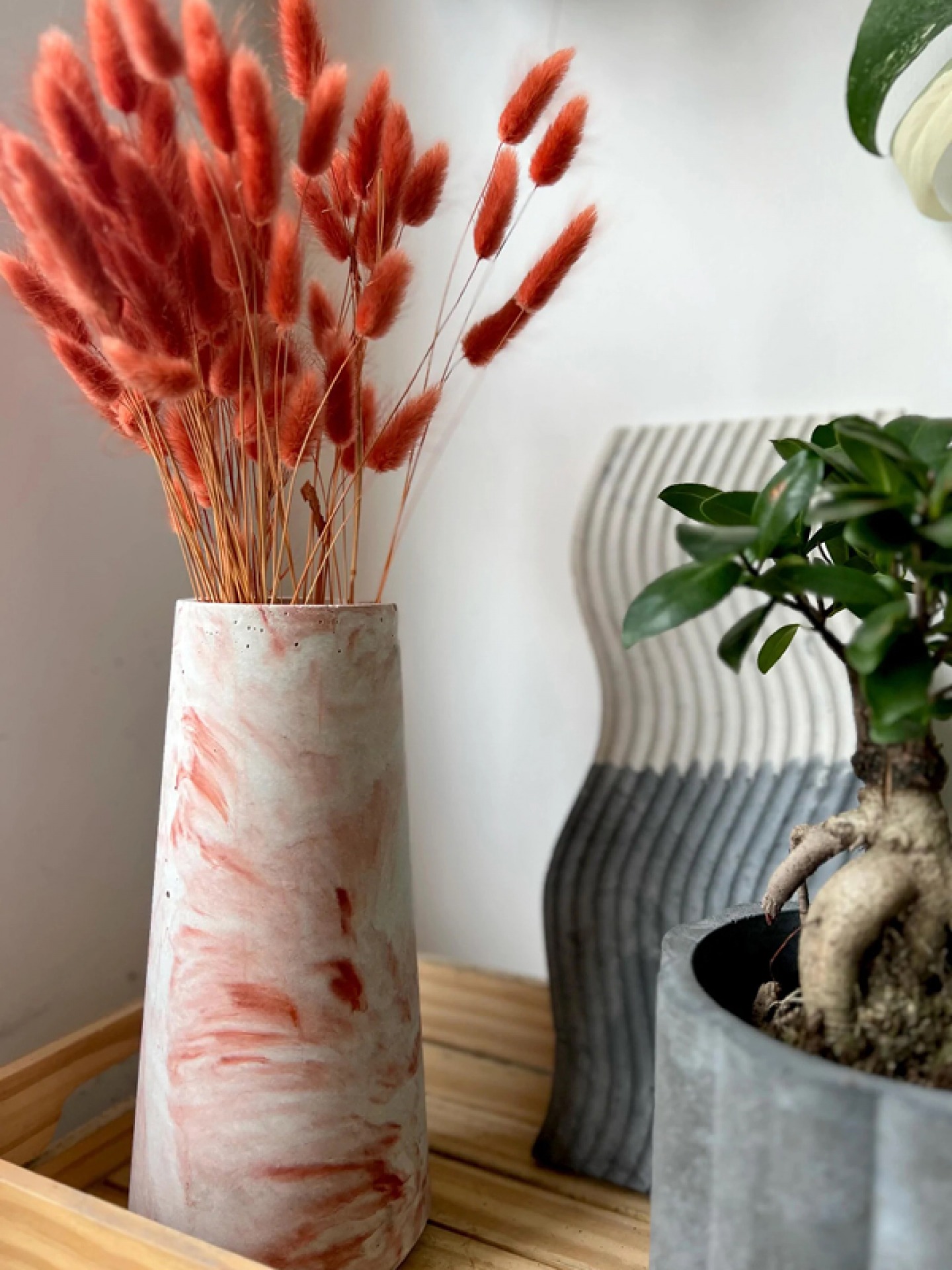 vase with dried grass in it