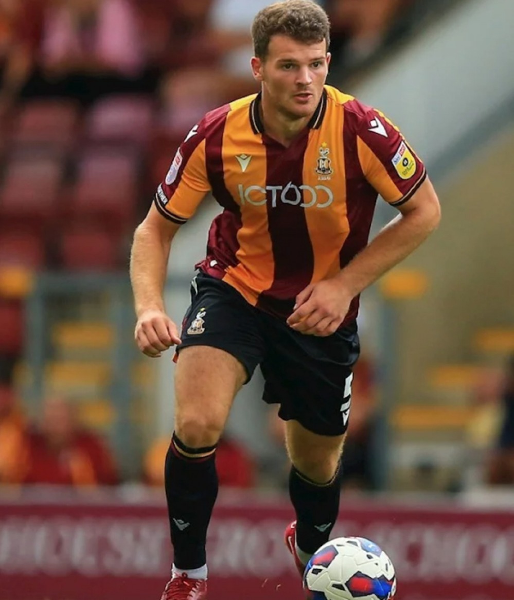 footballer kicking ball