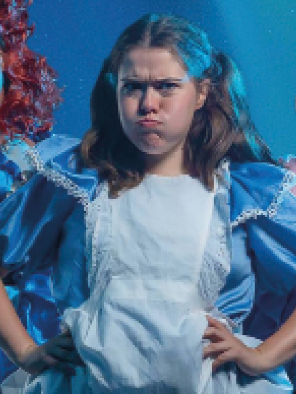 Girls puffing her cheeks as Cinderella