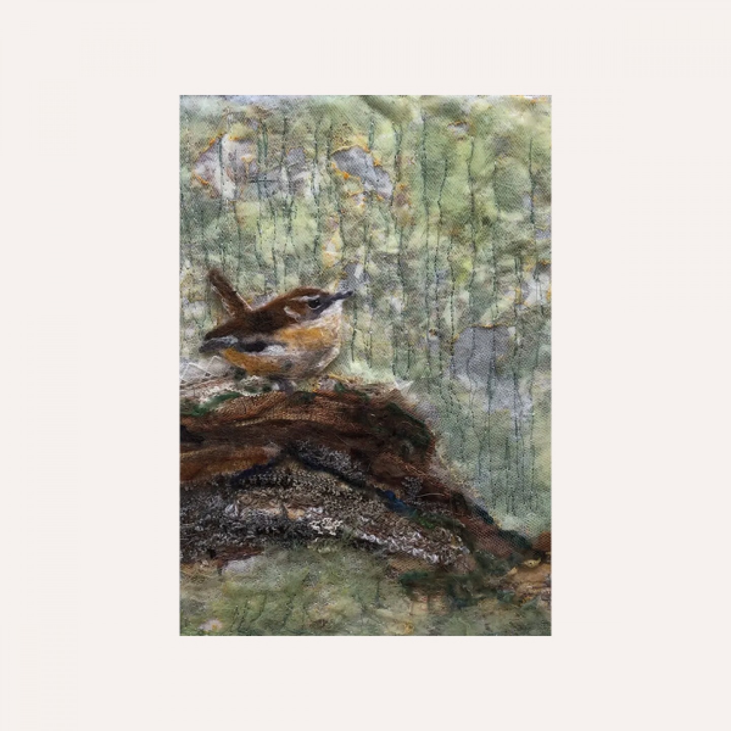 Textile art of a robin sitting on a log