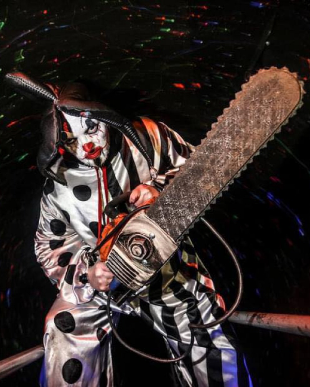Scary Clown wielding a large chainsaw