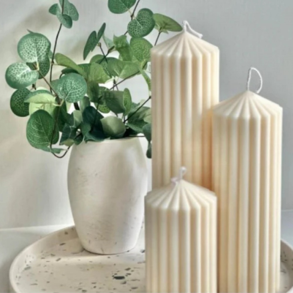 Candles and eucalyptus in a vase