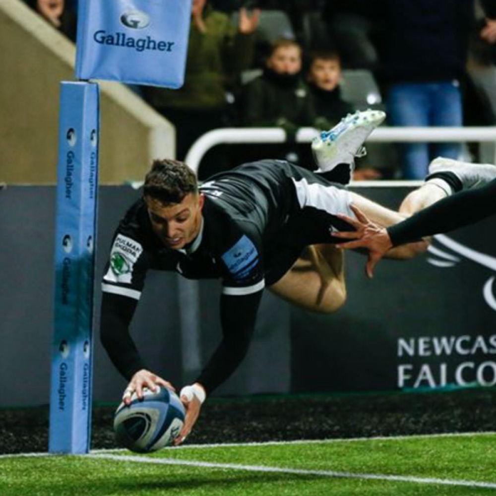 rugby player running with the ball