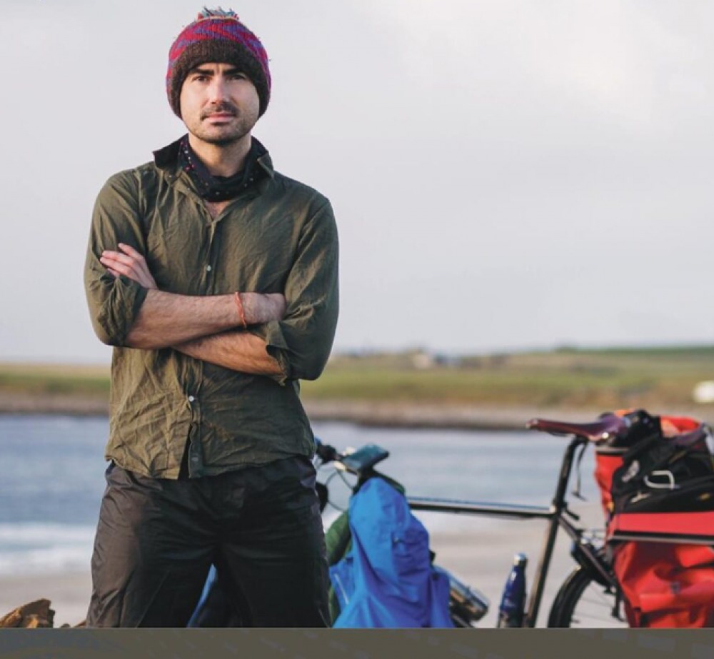 Simon Parker standing with his bike