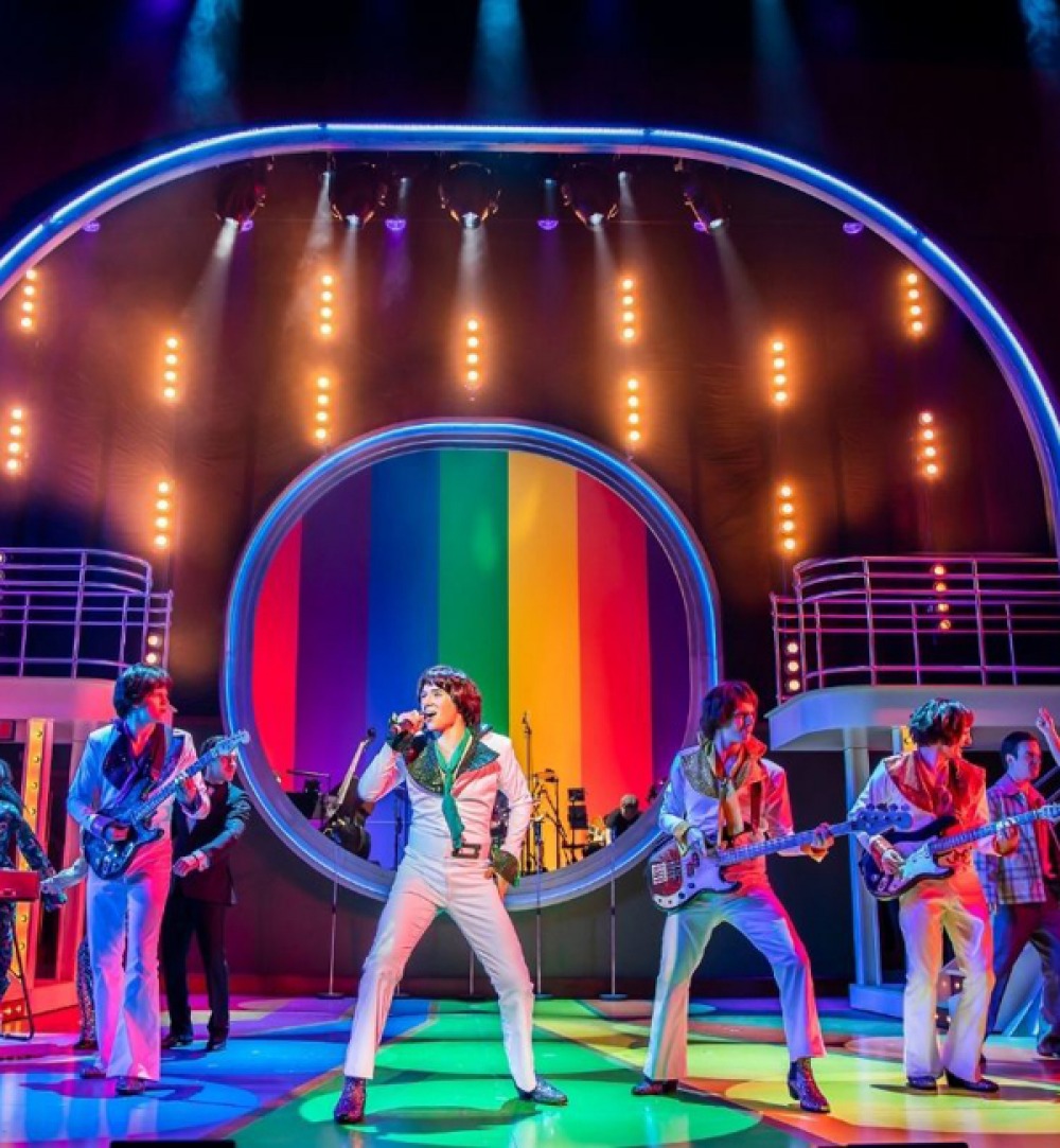 Performers on stage of The Osmonds musical