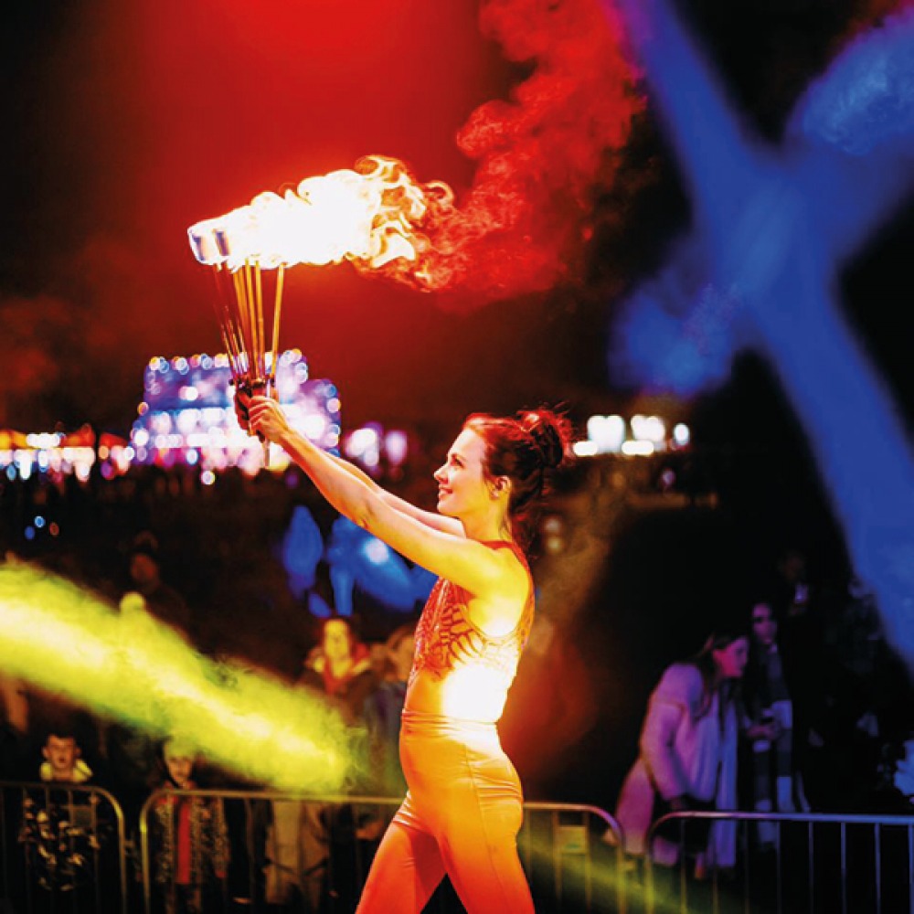 Woman with flaming batons