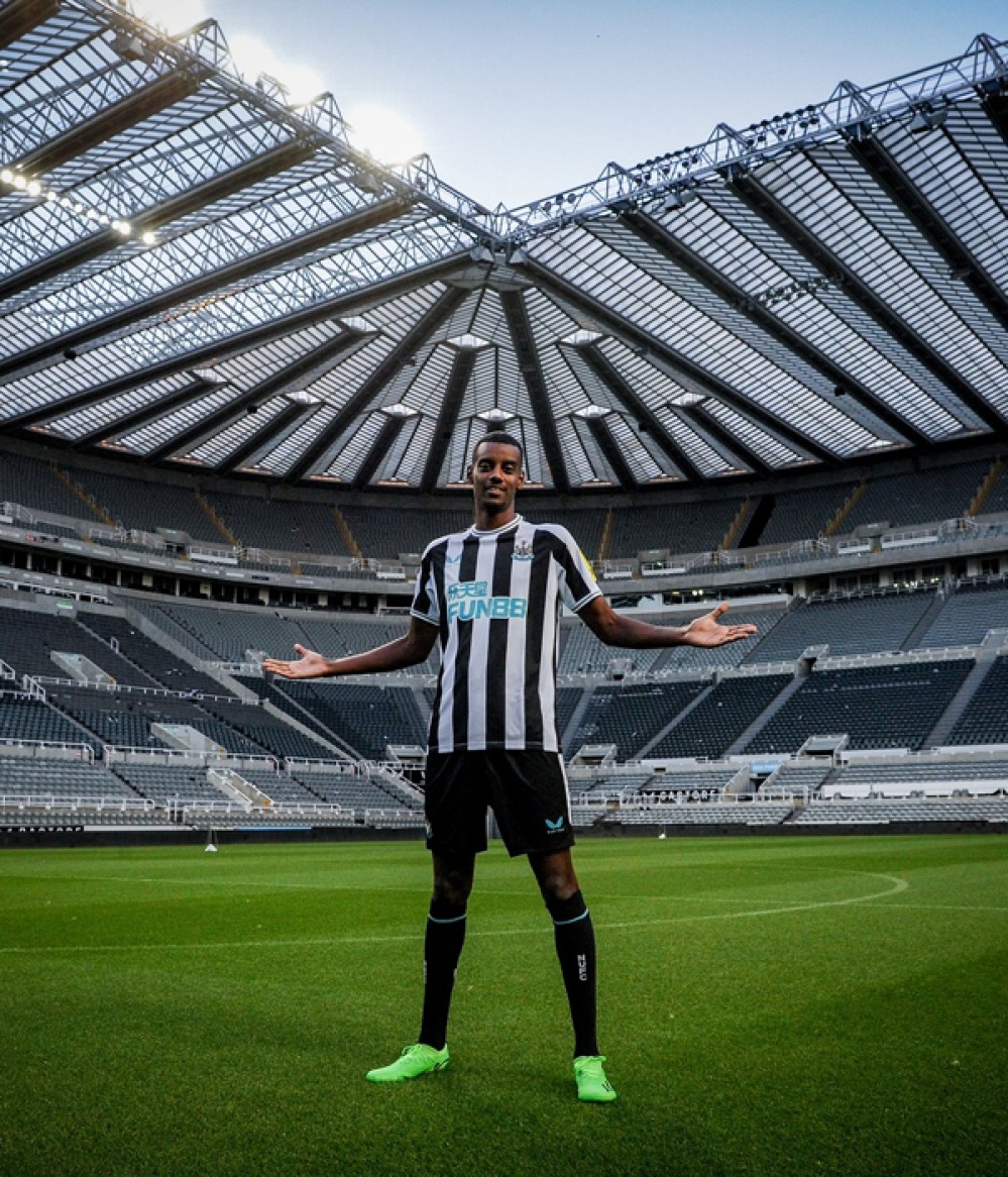 Footballer standing on the pitch in St James Park